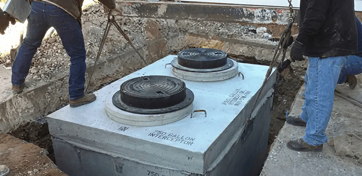 Grease trap installation for a commercial property drainage system in Evansville, IN